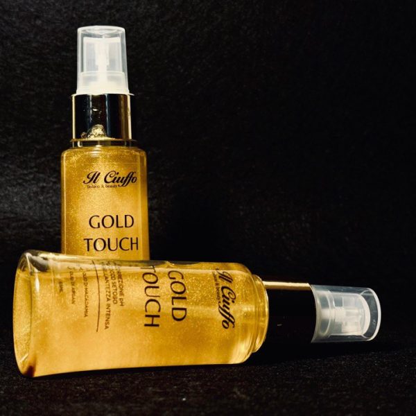 Profumo Oro Touch in bottiglia spray, elegante e lussuoso.